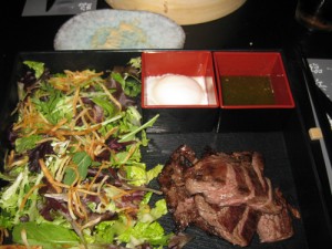 Steak-in-the-box, Thai style angus skirt steak with a soft boiled egg and mixed salad with crispy shredded potato, $19