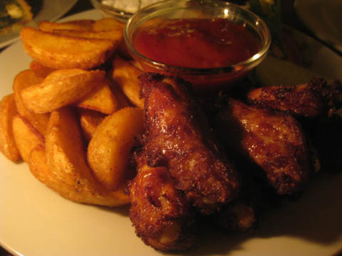 Most delicious chicken wings ever served with potato wedges